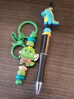 Blue Dinosaur Beaded Pen and Green Artist Dinosaur Keychain